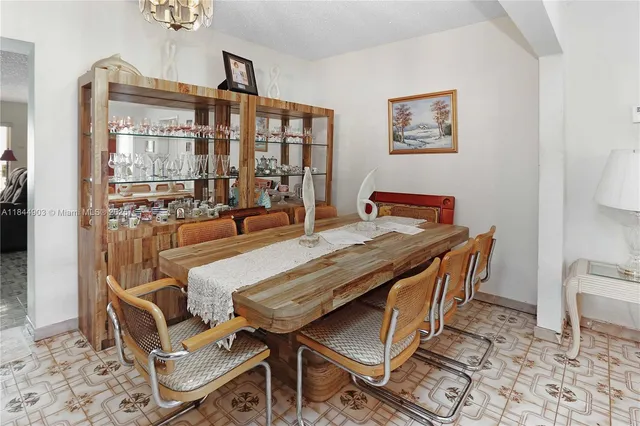 a living room with furniture window and wooden floor