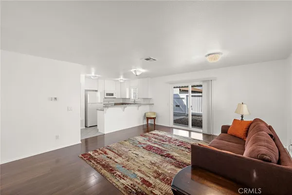 a living room with a couch and cabinets