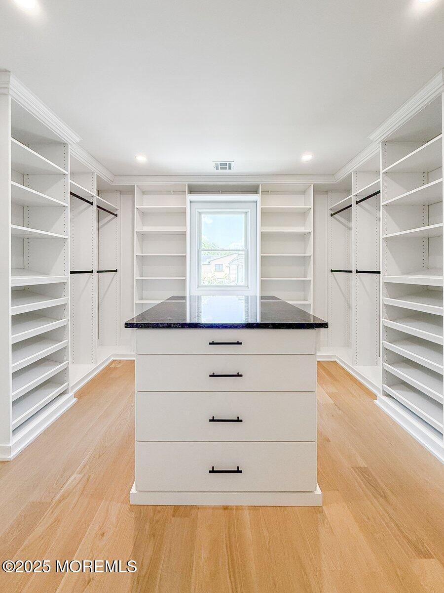 806 Arbor Road Paramus, NJ 07652 - Photo 15 of 29 a view of walk in closet with empty racks