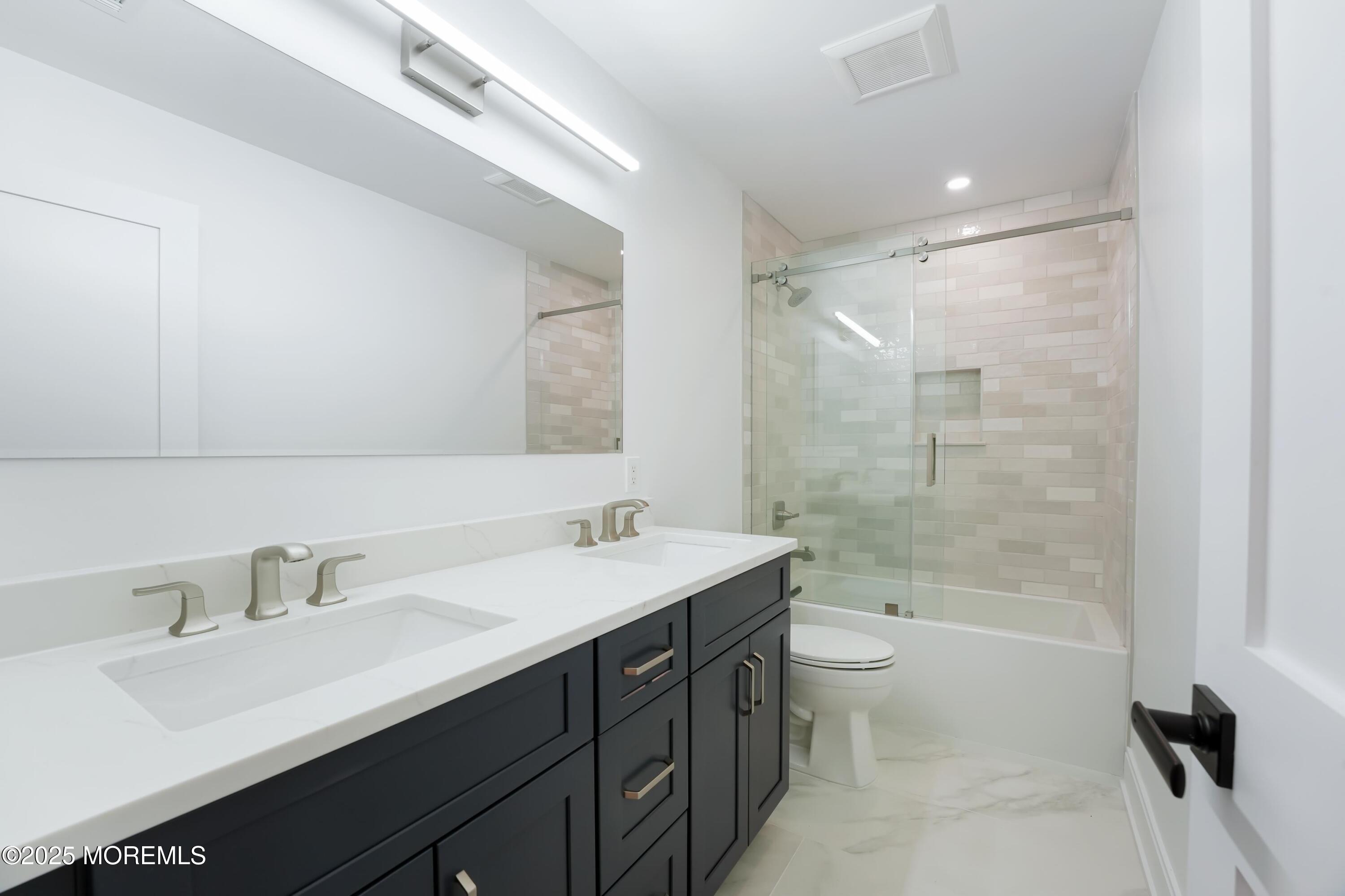 806 Arbor Road Paramus, NJ 07652 - Photo 20 of 29 a bathroom with a sink a toilet and shower