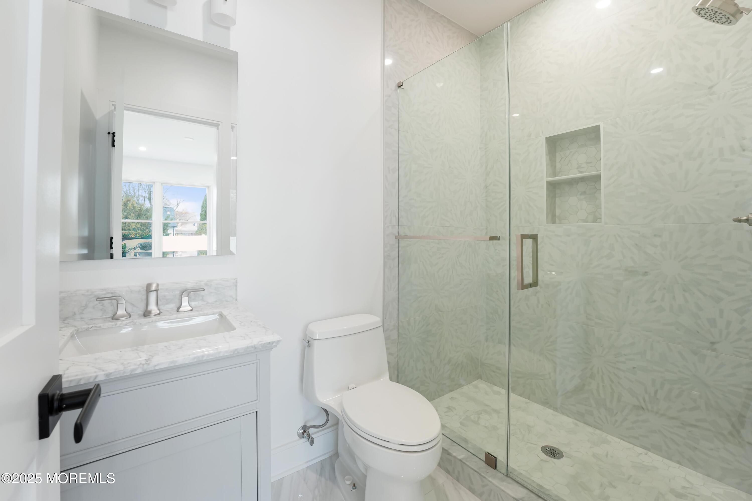 806 Arbor Road Paramus, NJ 07652 - Photo 25 of 29 a bathroom with a sink toilet and shower