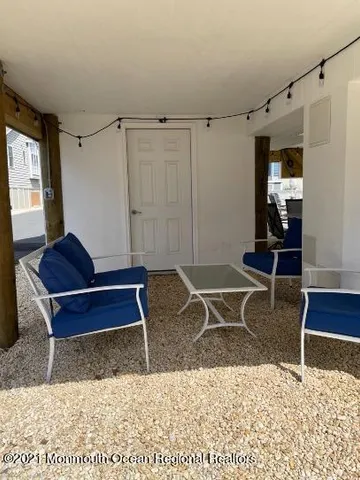 a living room with a couch and a rug