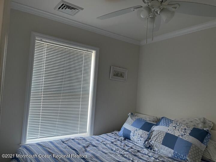 121 West Tide Way Lavallette, NJ 08735 - Photo 20 of 20 a bedroom with a bed and a window