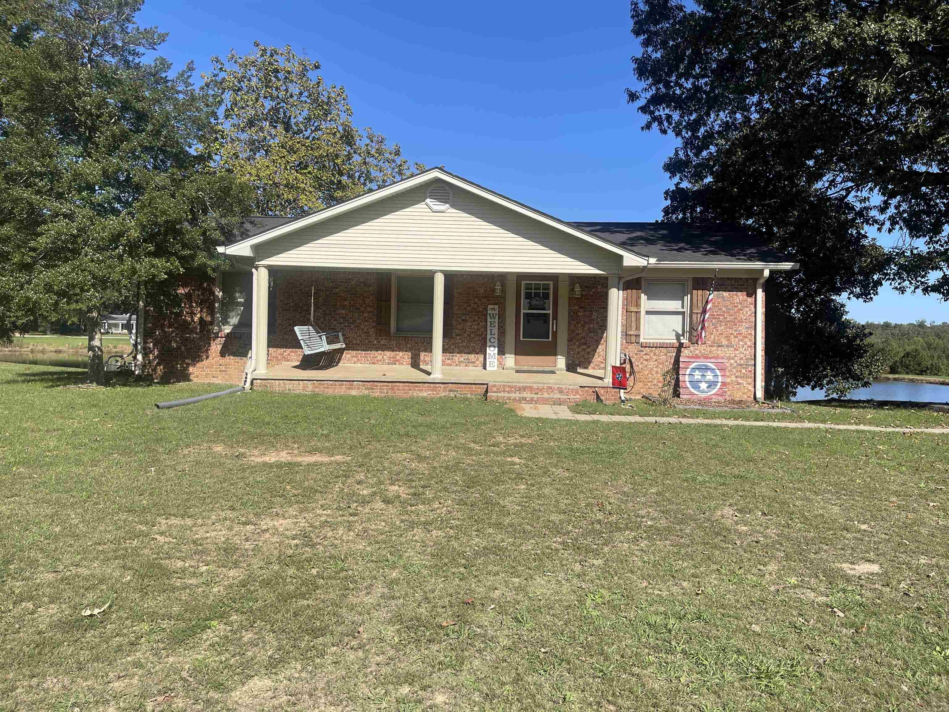 81 Puron Road Adamsville, TN 38310 - Photo 1 of 40 a front view of house with yard and green space