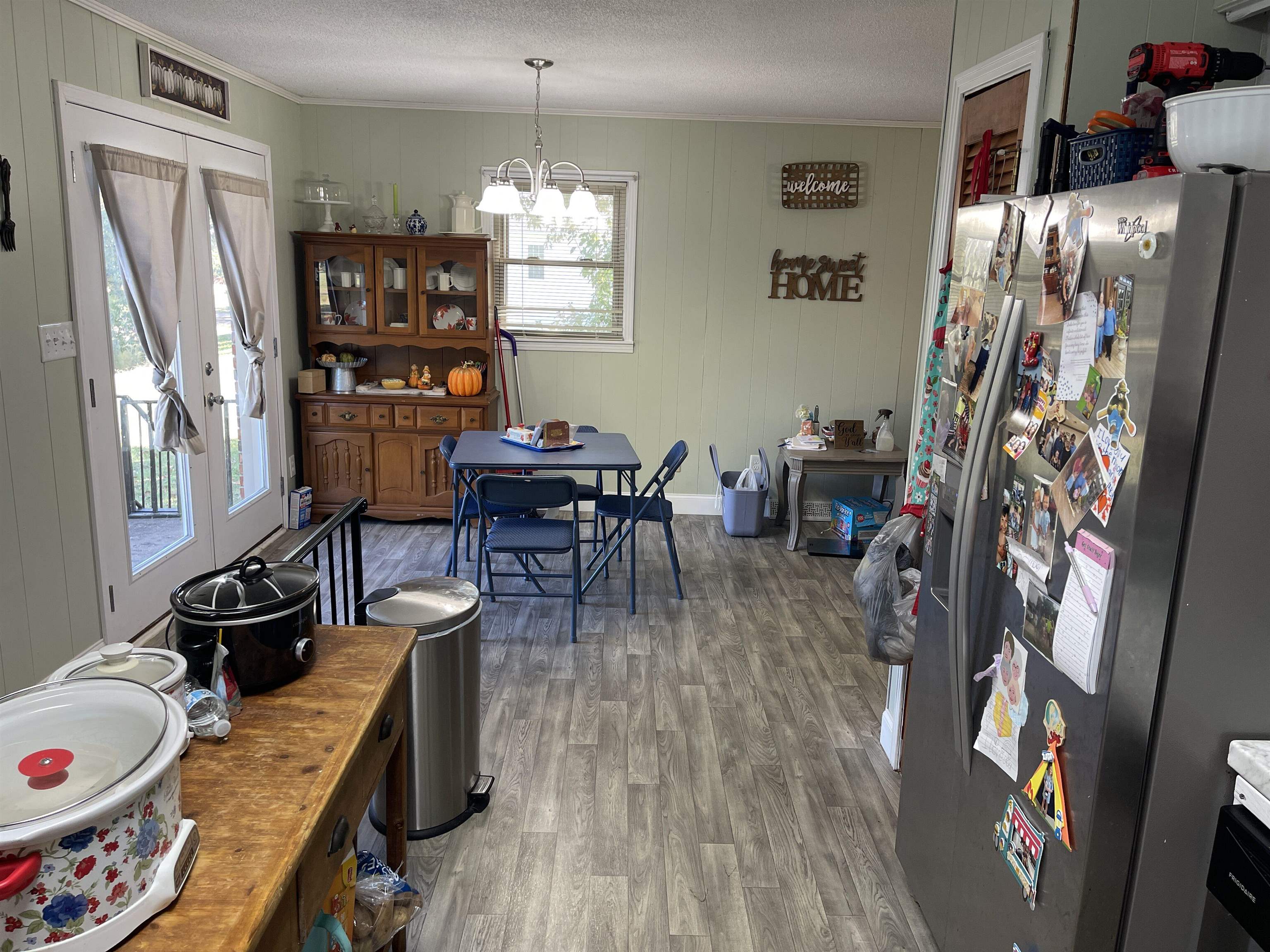 81 Puron Road Adamsville, TN 38310 - Photo 12 of 40 a view of a dining room with furniture window and wooden floor