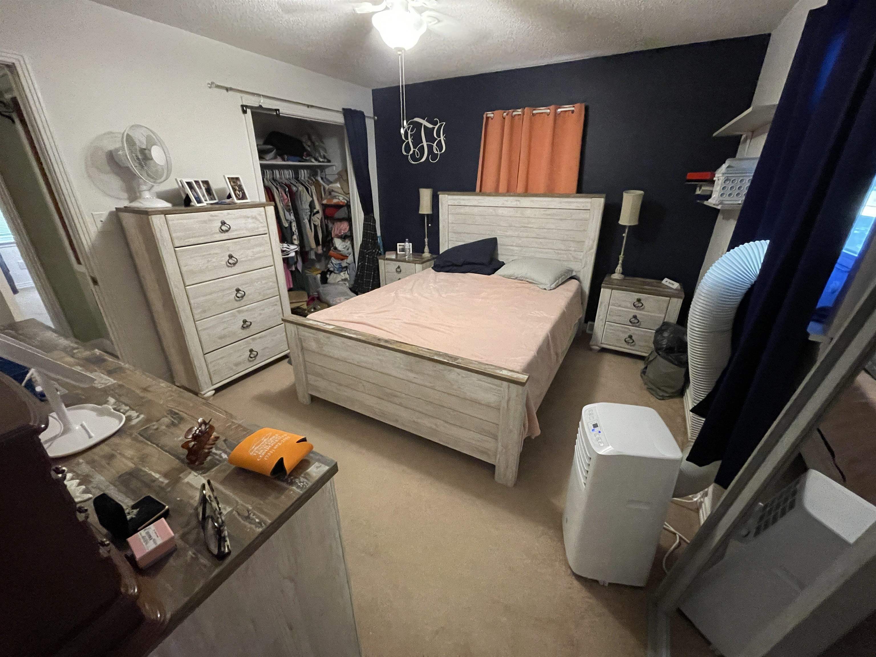 81 Puron Road Adamsville, TN 38310 - Photo 20 of 40 a bed room with a bed and furniture