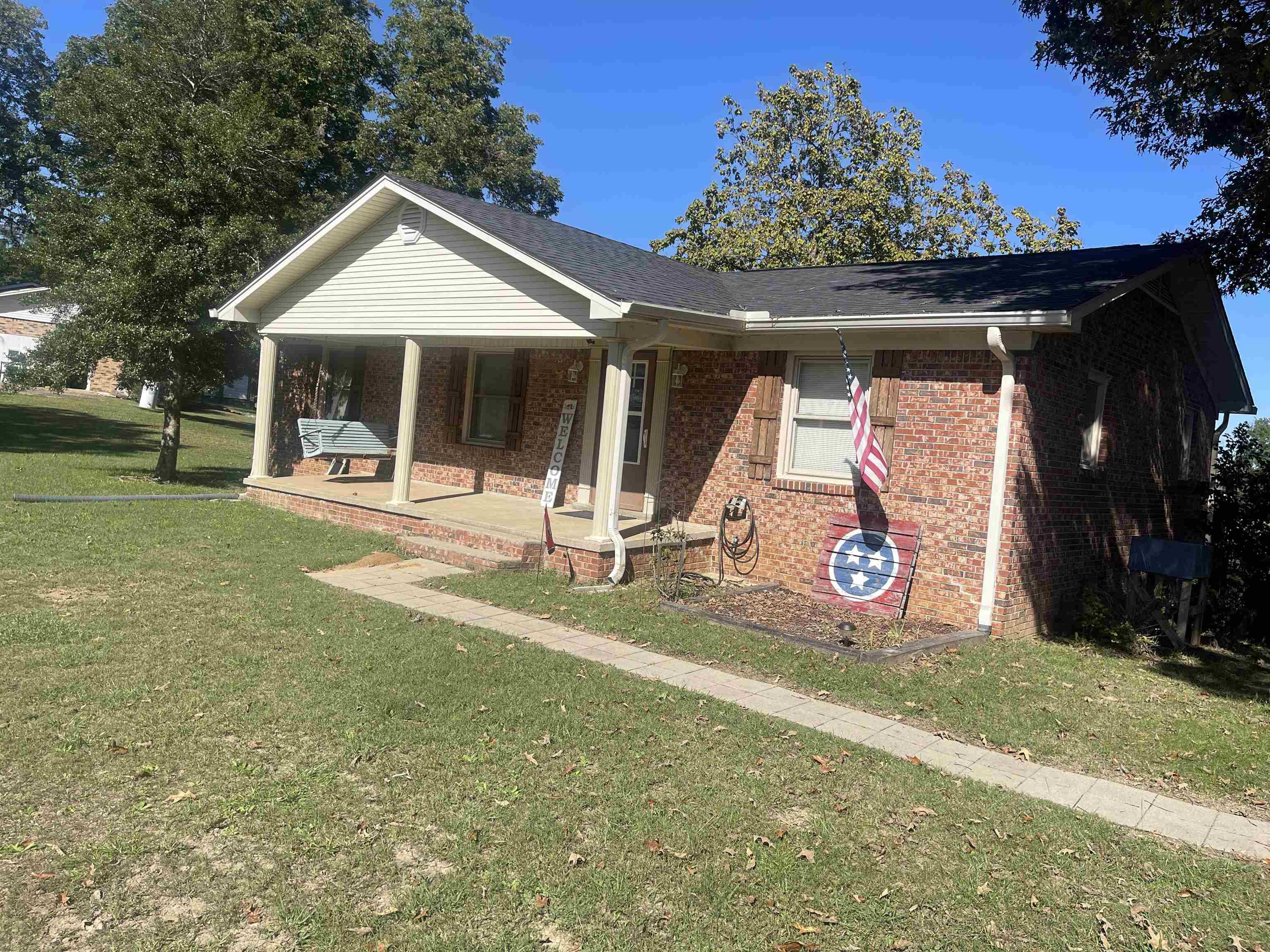 81 Puron Road Adamsville, TN 38310 - Photo 2 of 40 a front view of a house with a yard