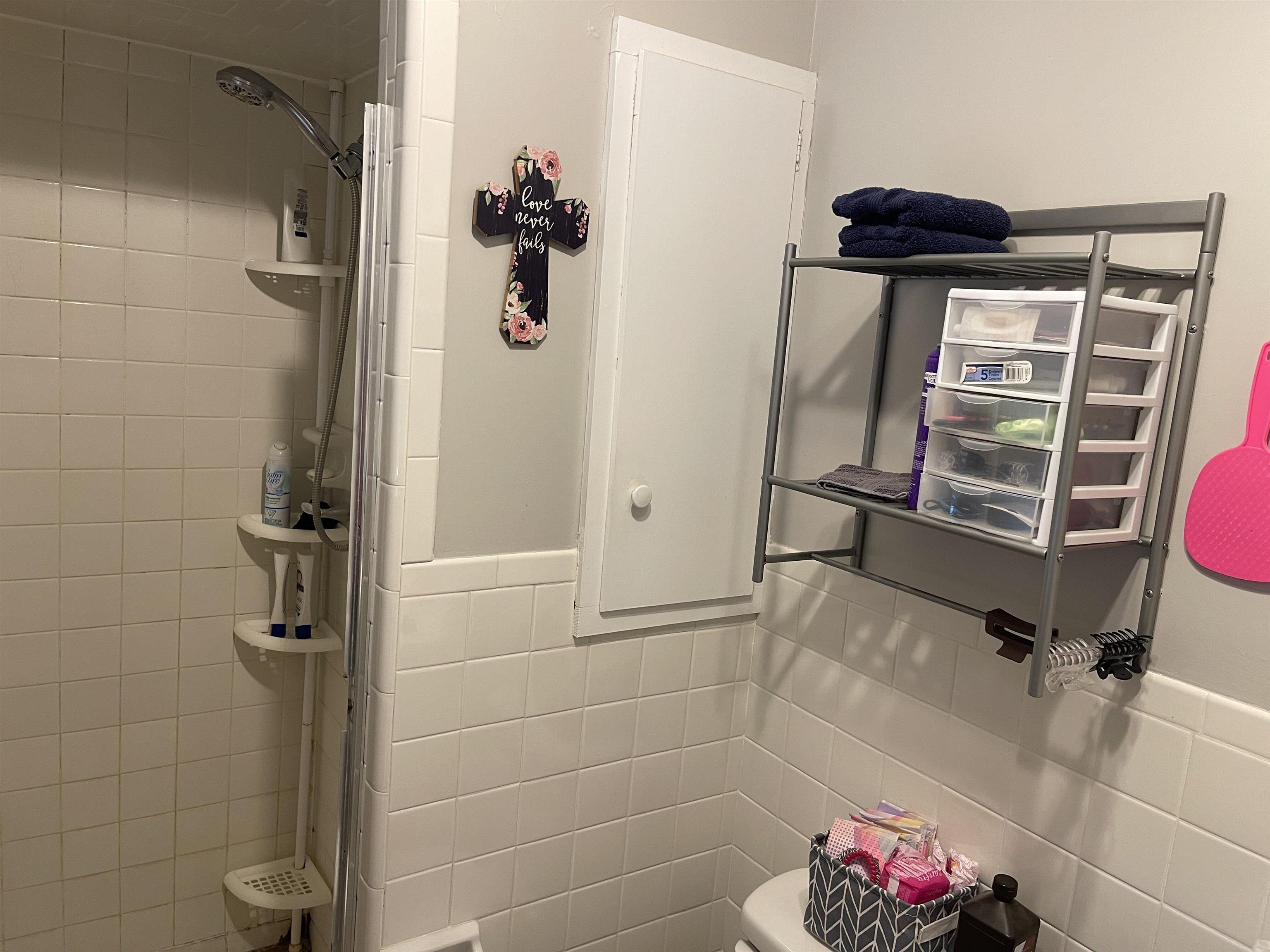 81 Puron Road Adamsville, TN 38310 - Photo 21 of 40 a bathroom with a shower