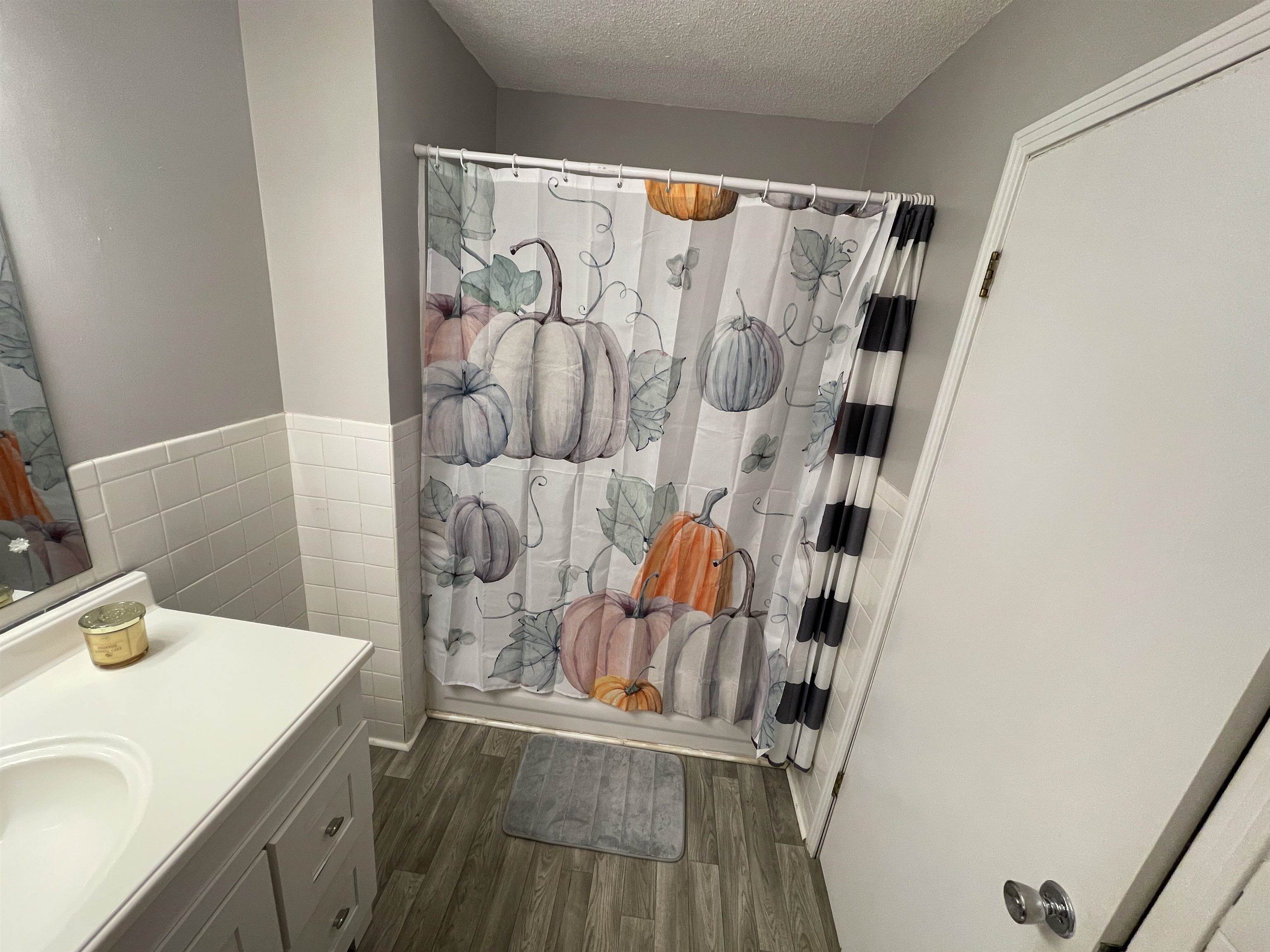 81 Puron Road Adamsville, TN 38310 - Photo 25 of 40 a bathroom with a sink and a shower curtain