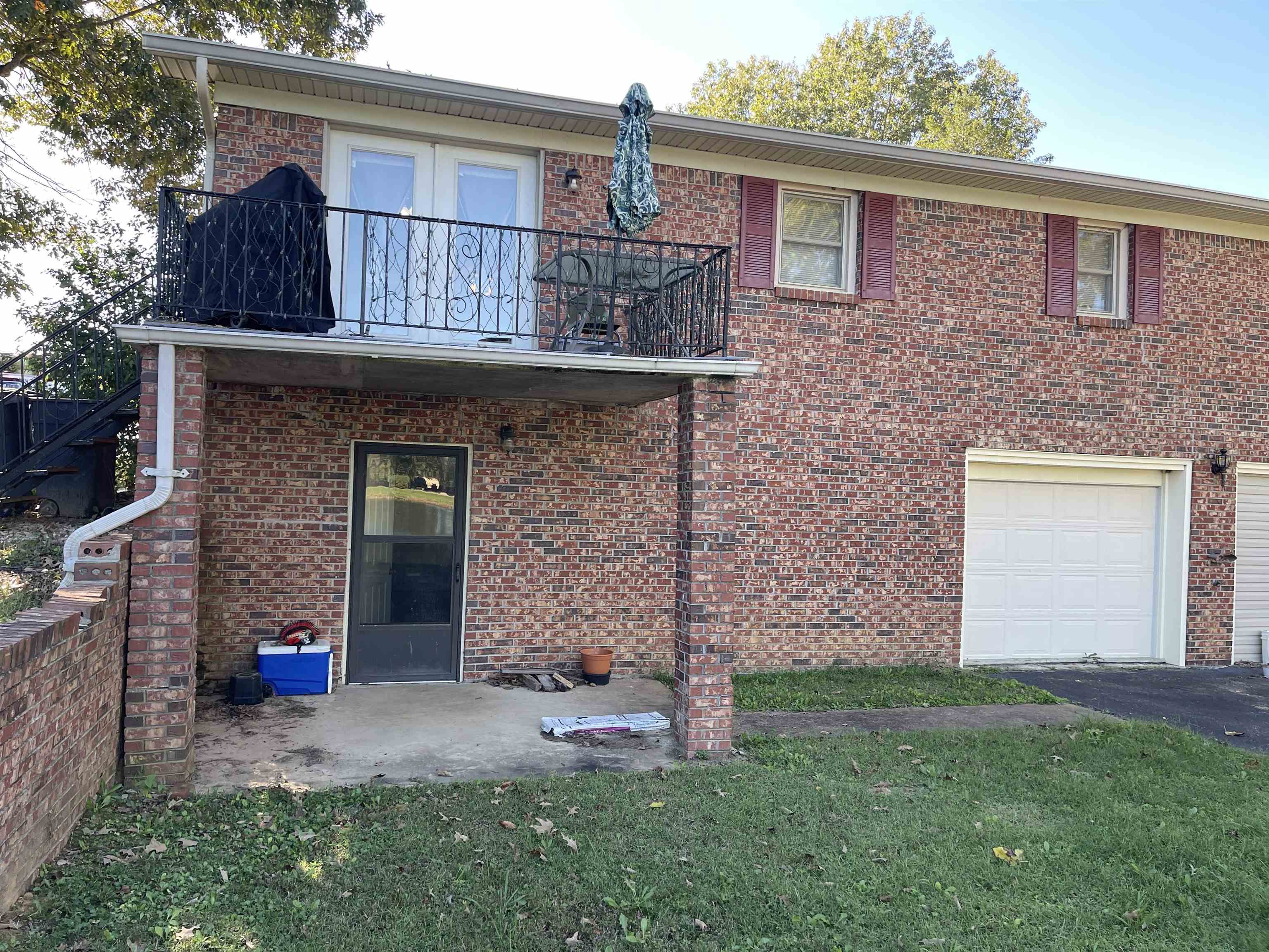 81 Puron Road Adamsville, TN 38310 - Photo 32 of 40 a front view of a house with garden