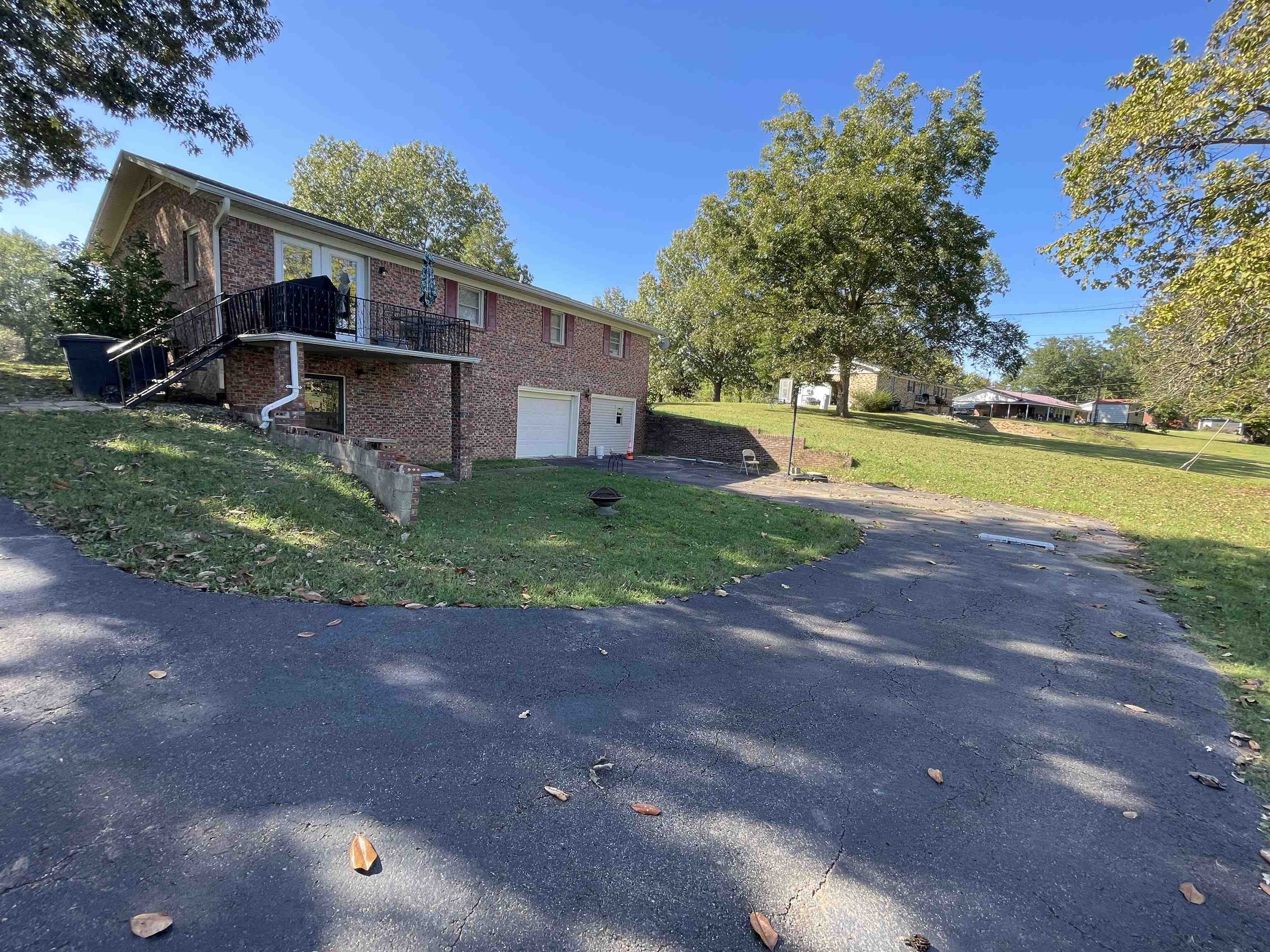 81 Puron Road Adamsville, TN 38310 - Photo 33 of 40 a view of a house with a yard