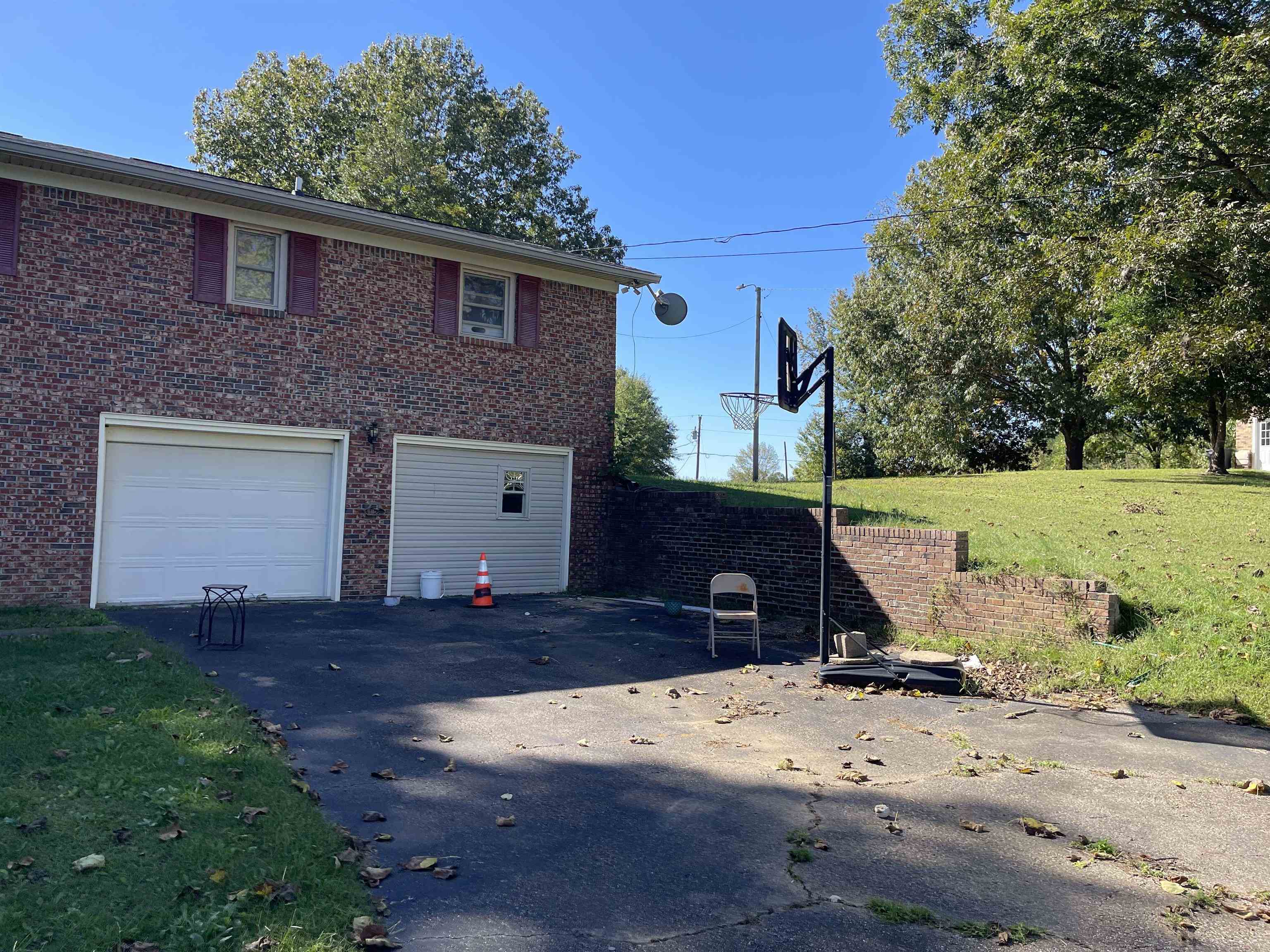 81 Puron Road Adamsville, TN 38310 - Photo 35 of 40 a front view of a house with a yard