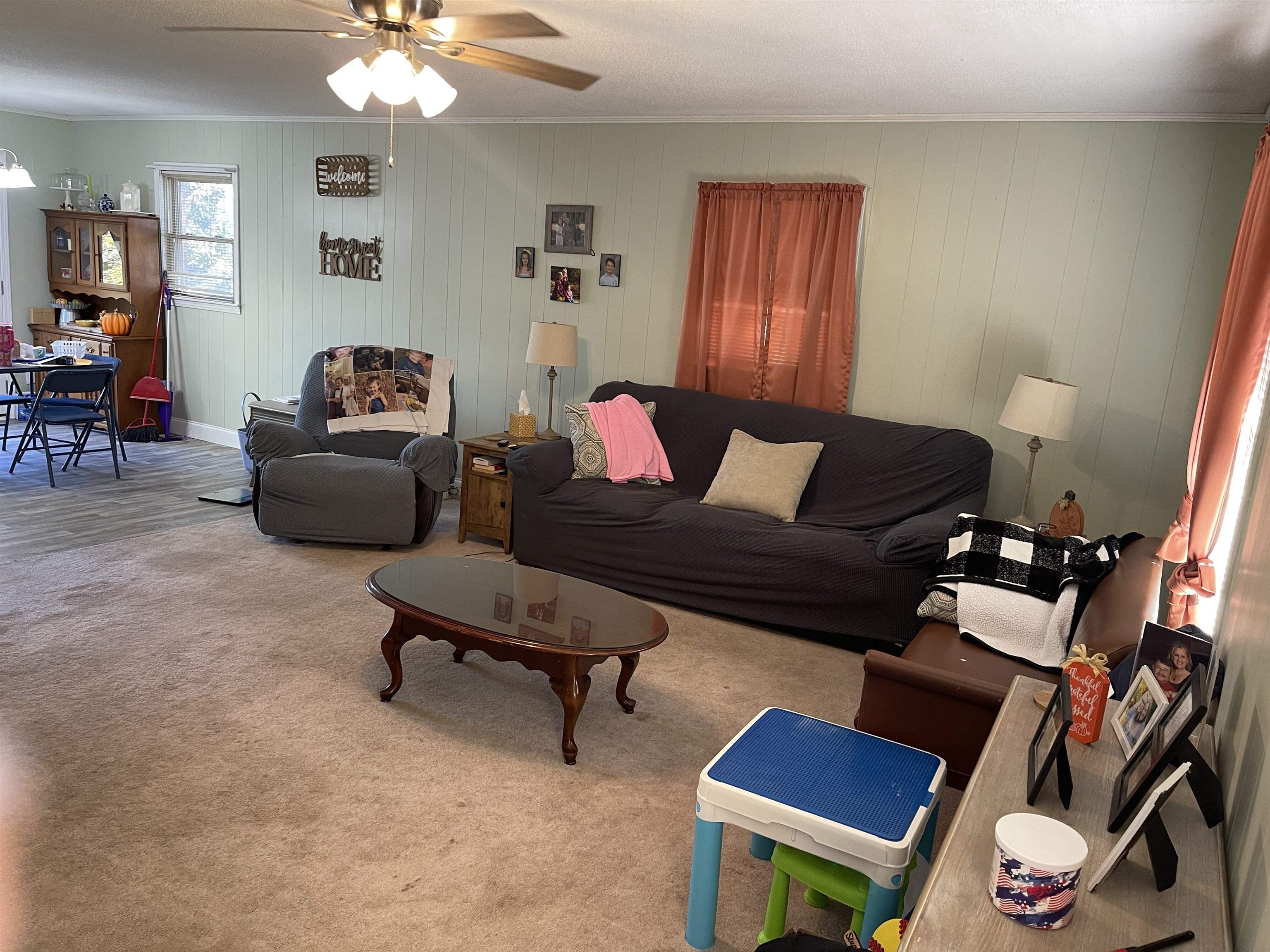 81 Puron Road Adamsville, TN 38310 - Photo 5 of 40 a living room with furniture and a lamp