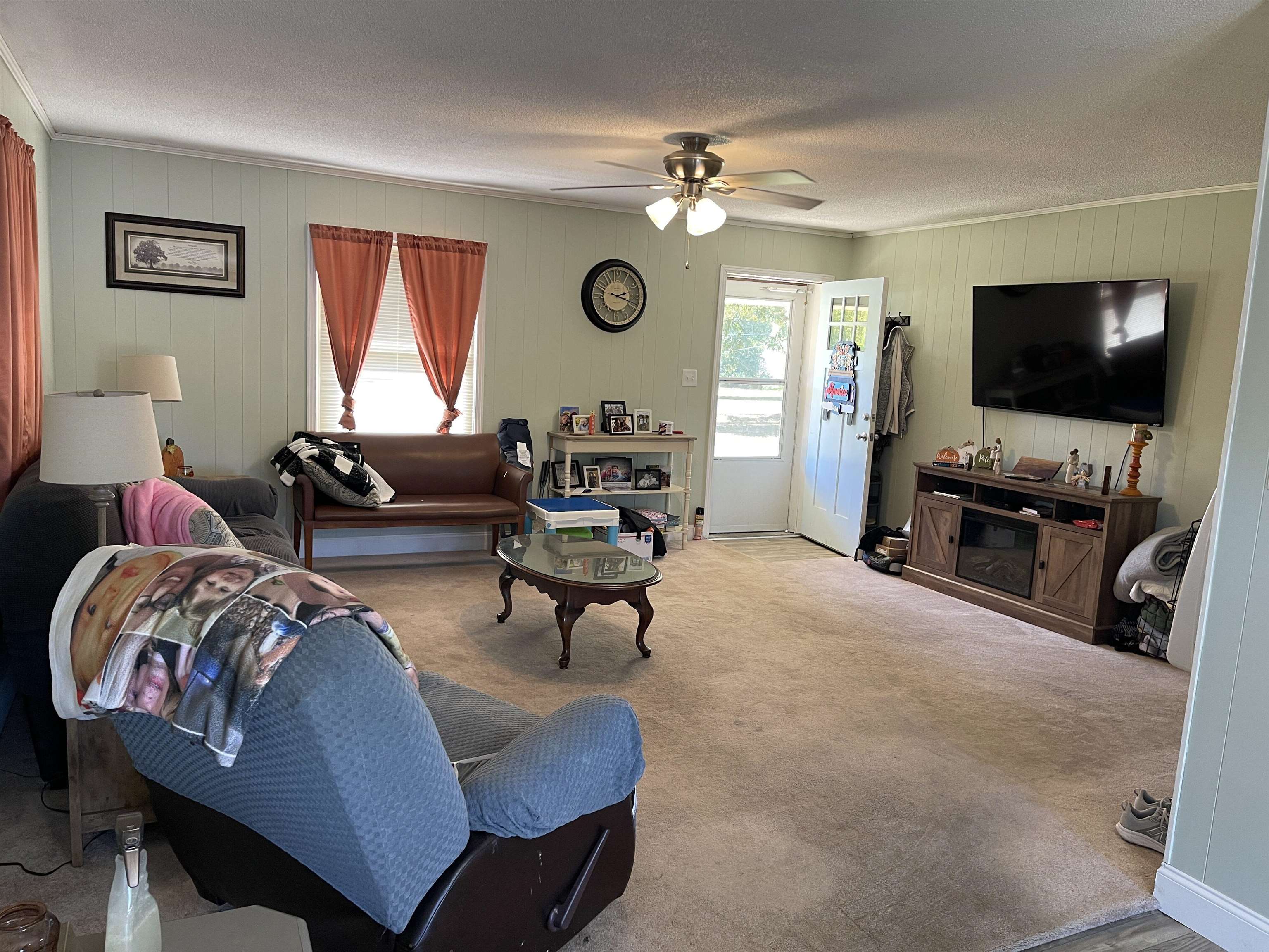 81 Puron Road Adamsville, TN 38310 - Photo 6 of 40 a living room with furniture and a flat screen tv