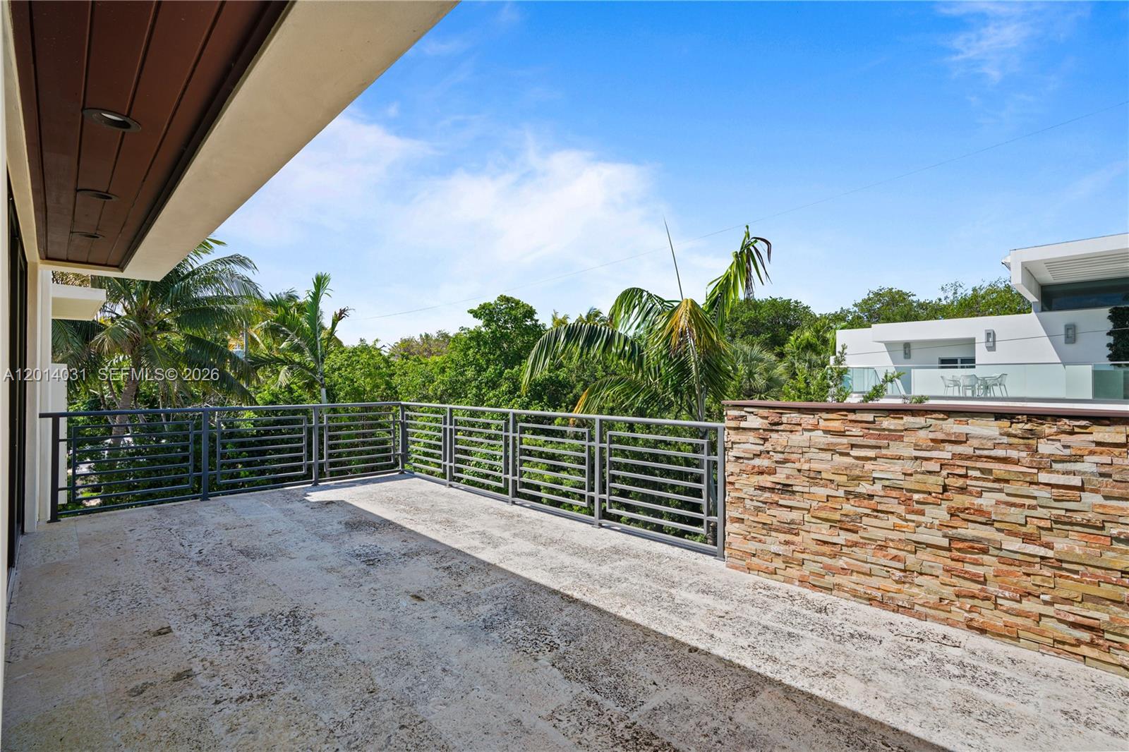 762 Fernwood Road Key Biscayne, FL 33149 - Photo 53 of 82 a view of a pathway with a building in the background