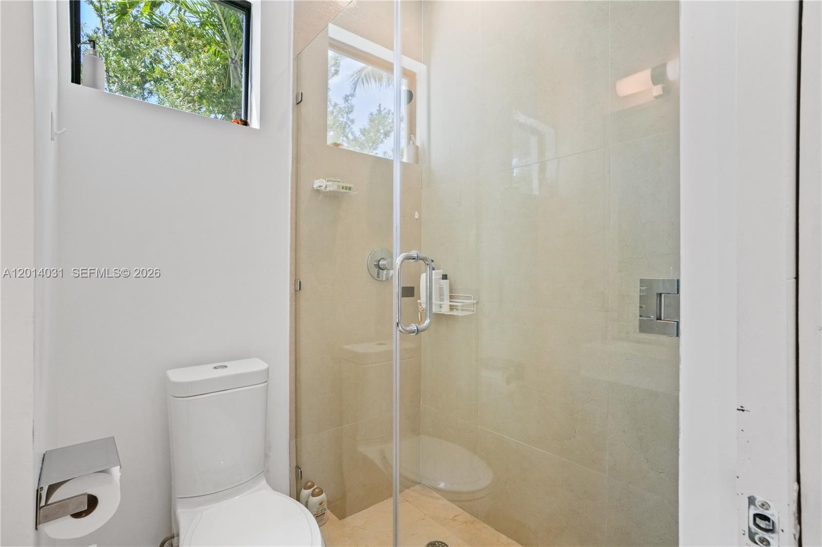 762 Fernwood Road Key Biscayne, FL 33149 - Photo 77 of 82 a bathroom with a toilet and a shower