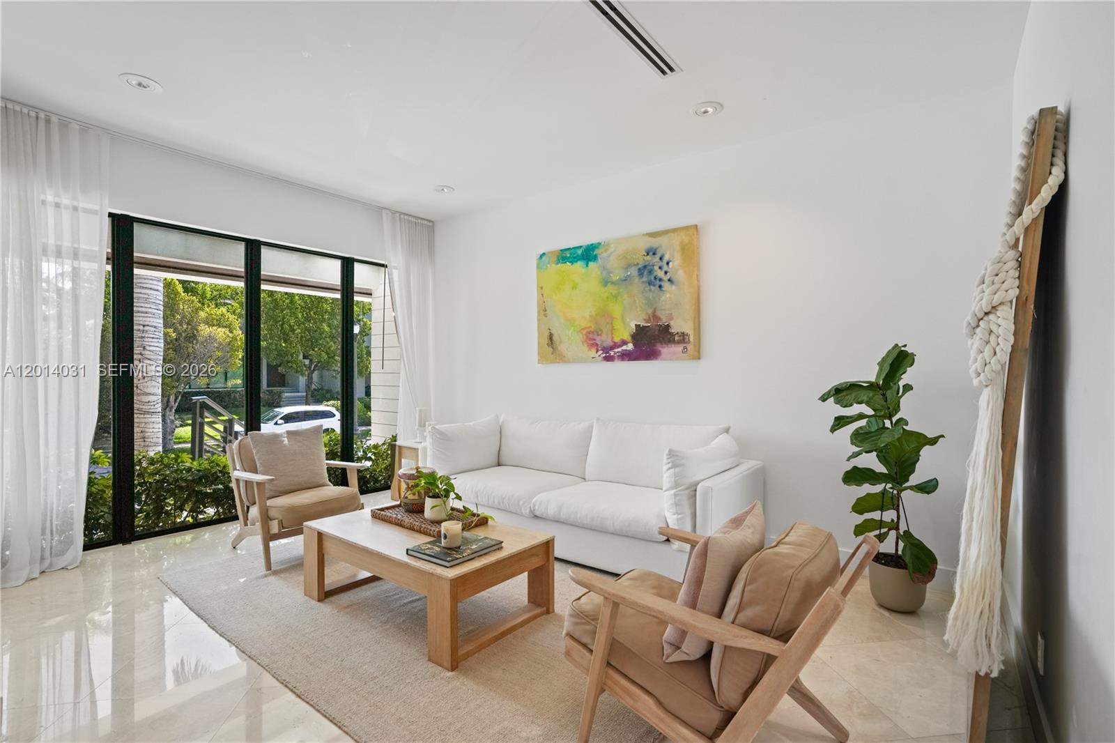 762 Fernwood Road Key Biscayne, FL 33149 - Photo 8 of 82 a living room with furniture and a large window