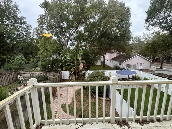 a view of a house with a small yard