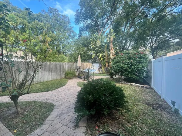 a view of backyard with green space