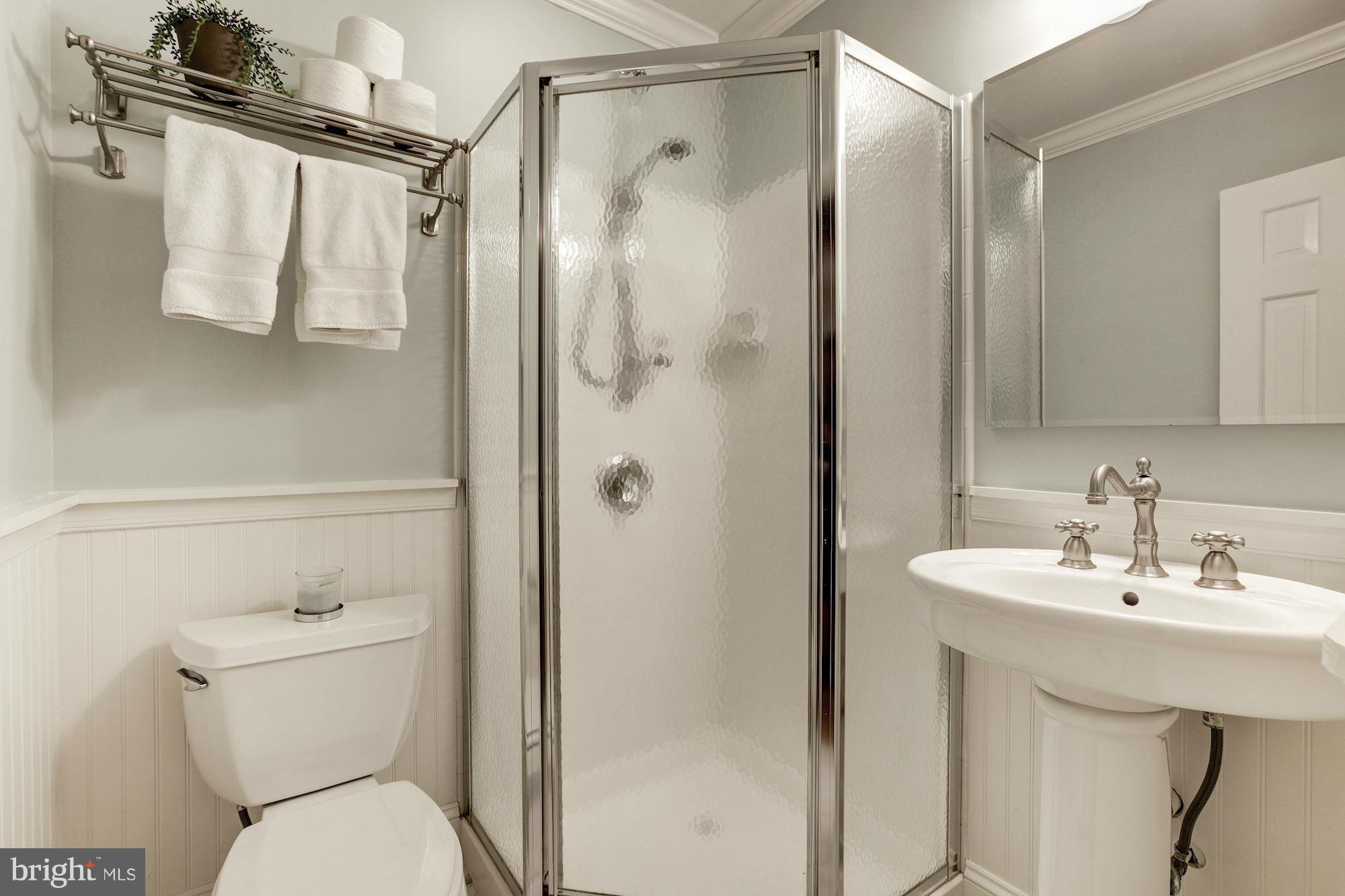 3055 Military Road Arlington, VA 22207 - Photo 13 of 30 a bathroom with a sink toilet and shower