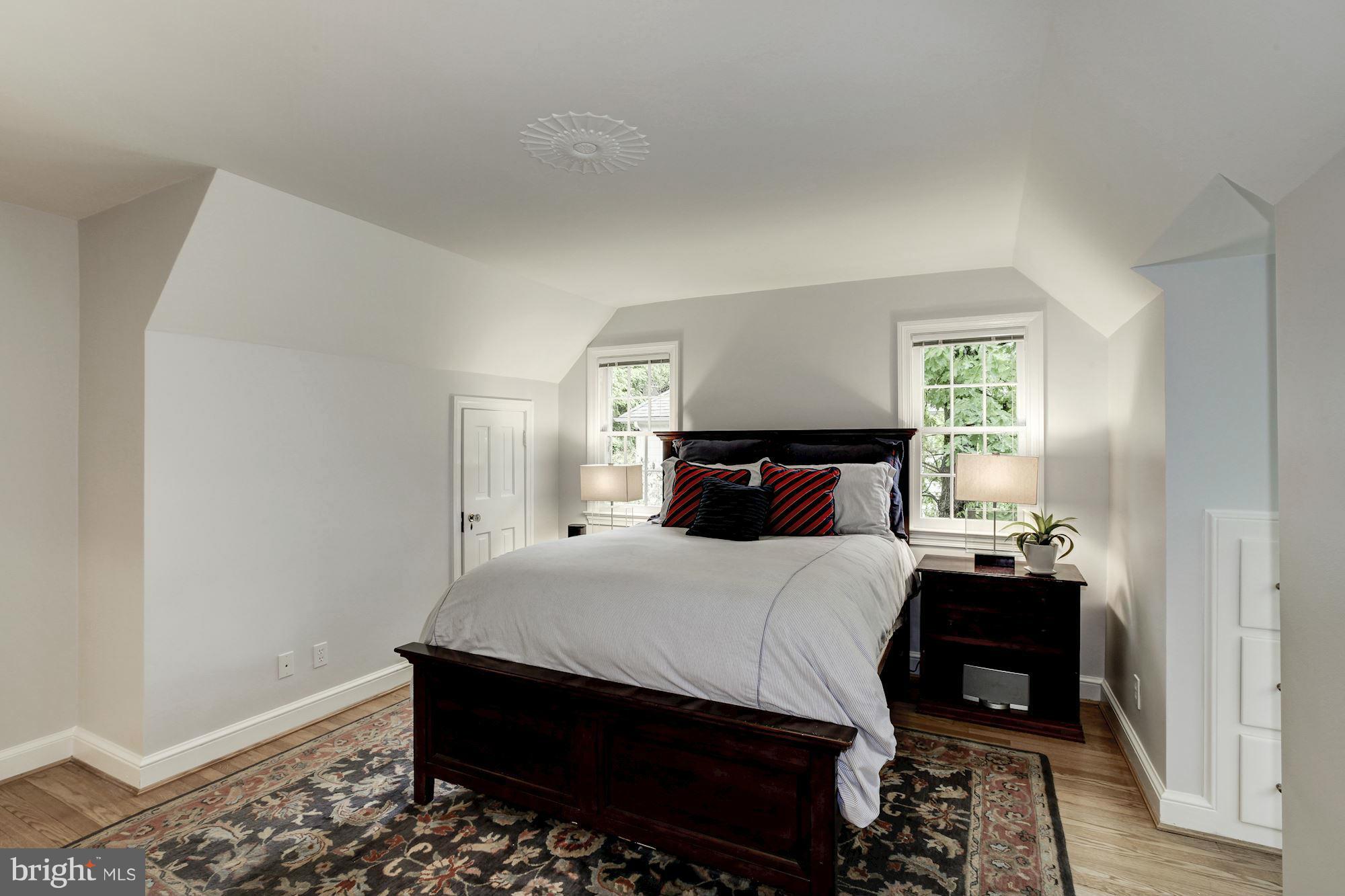 3055 Military Road Arlington, VA 22207 - Photo 18 of 30 a bedroom with a bed and wooden floor