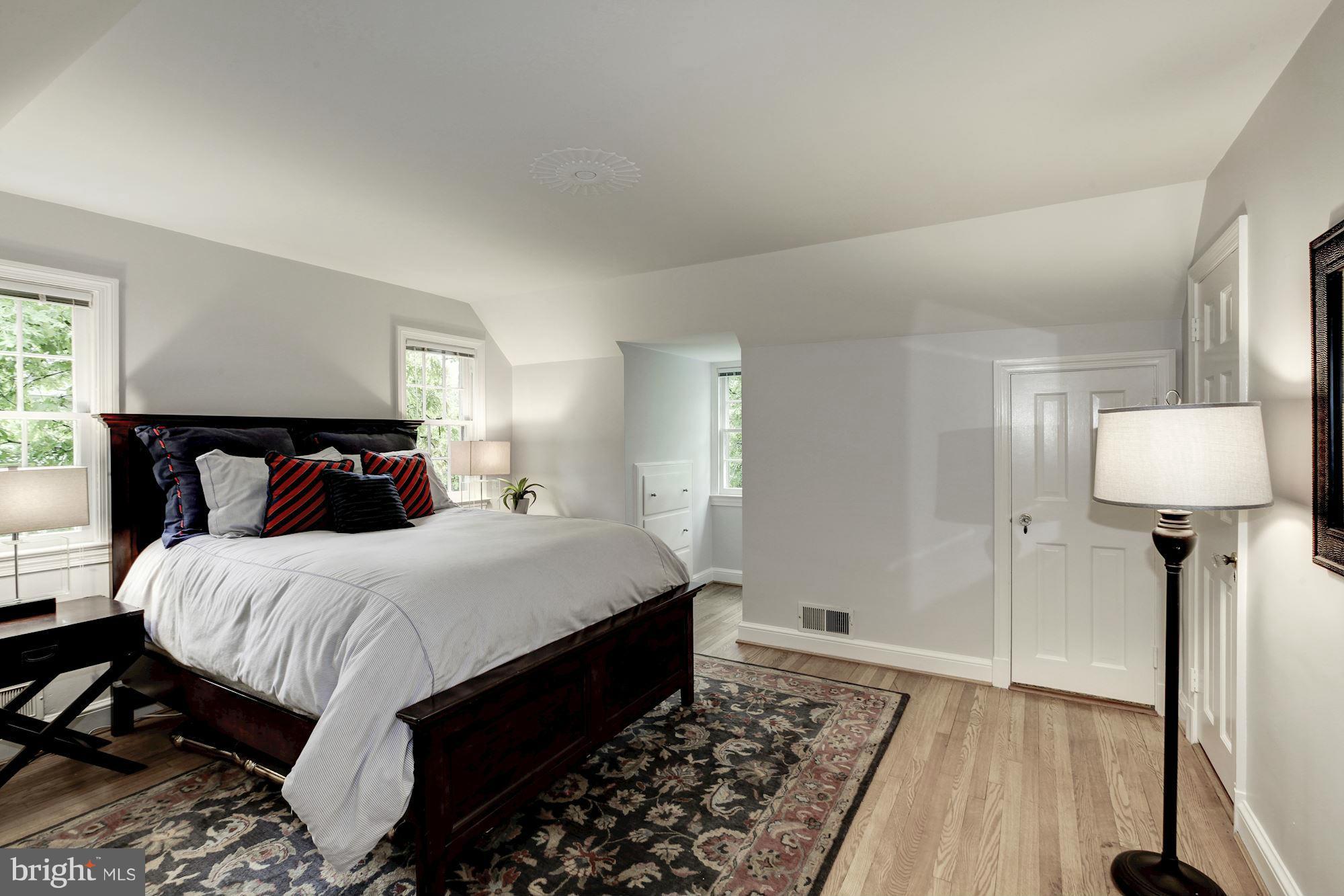 3055 Military Road Arlington, VA 22207 - Photo 19 of 30 a bedroom with bed and wooden floor