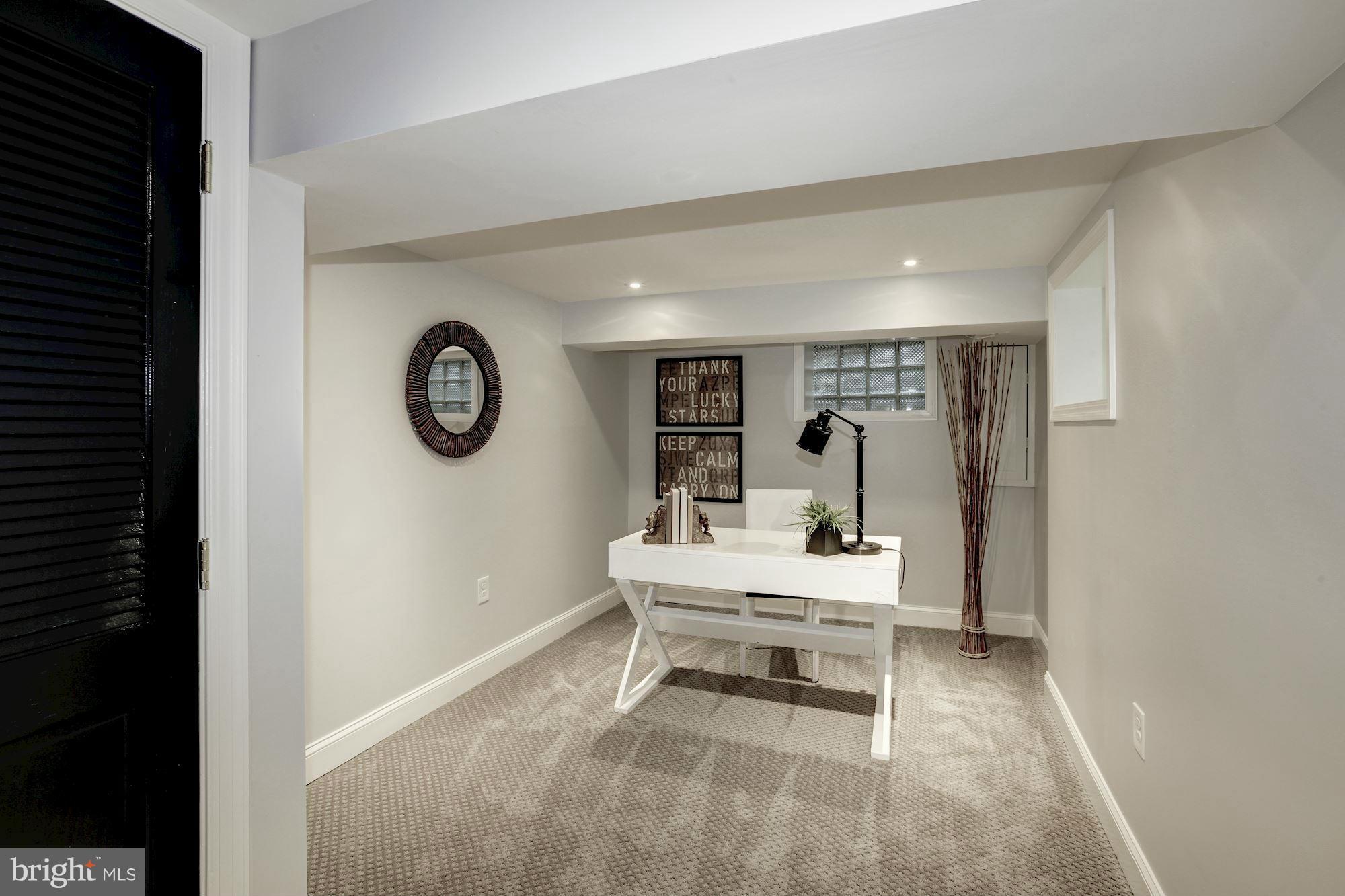 3055 Military Road Arlington, VA 22207 - Photo 25 of 30 a room with a clock on wall and a clock