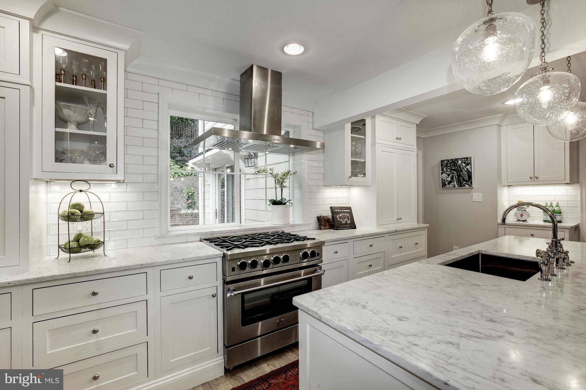 3055 Military Road Arlington, VA 22207 - Photo 9 of 30 a kitchen with a stove cabinets and window