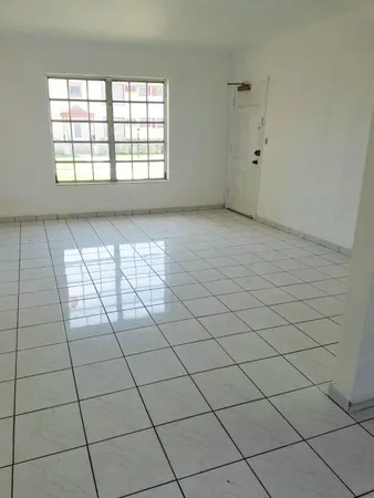 a view of an empty room and window