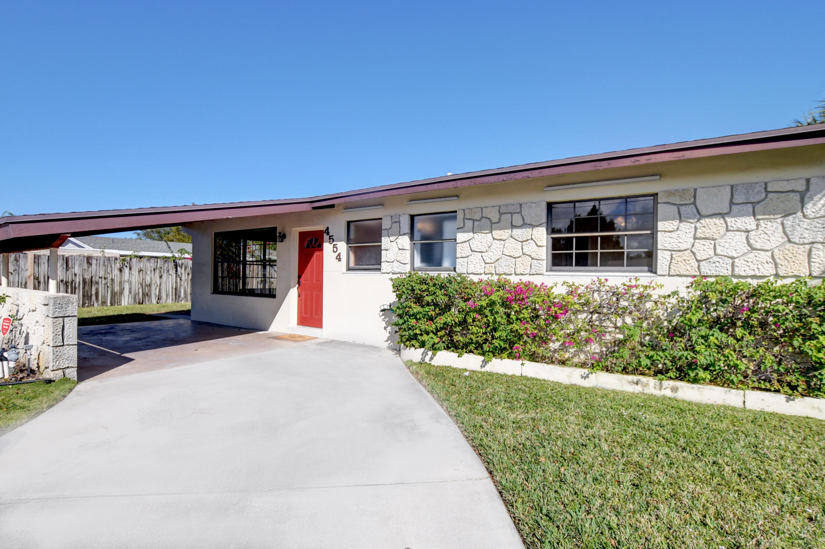 4554 Northeast 4th Avenue Boca Raton, FL 33431 - Photo 4 of 37 04_Convenient attached carport