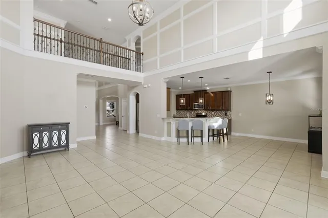 a large kitchen with stainless steel appliances granite countertop a sink stove and cabinets