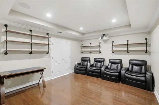 a view of a workspace with furniture and wooden floor