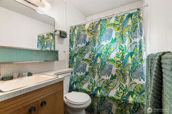 a bathroom with a sink and mirror