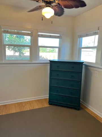 a room with a furniture and a window