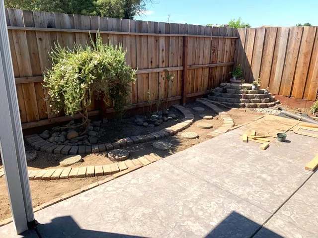 a view of a backyard of the house