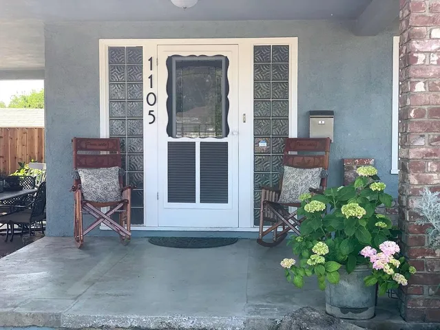 a front view of a house with a garden