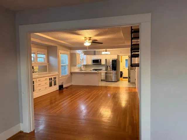 a view of a living room with a large window