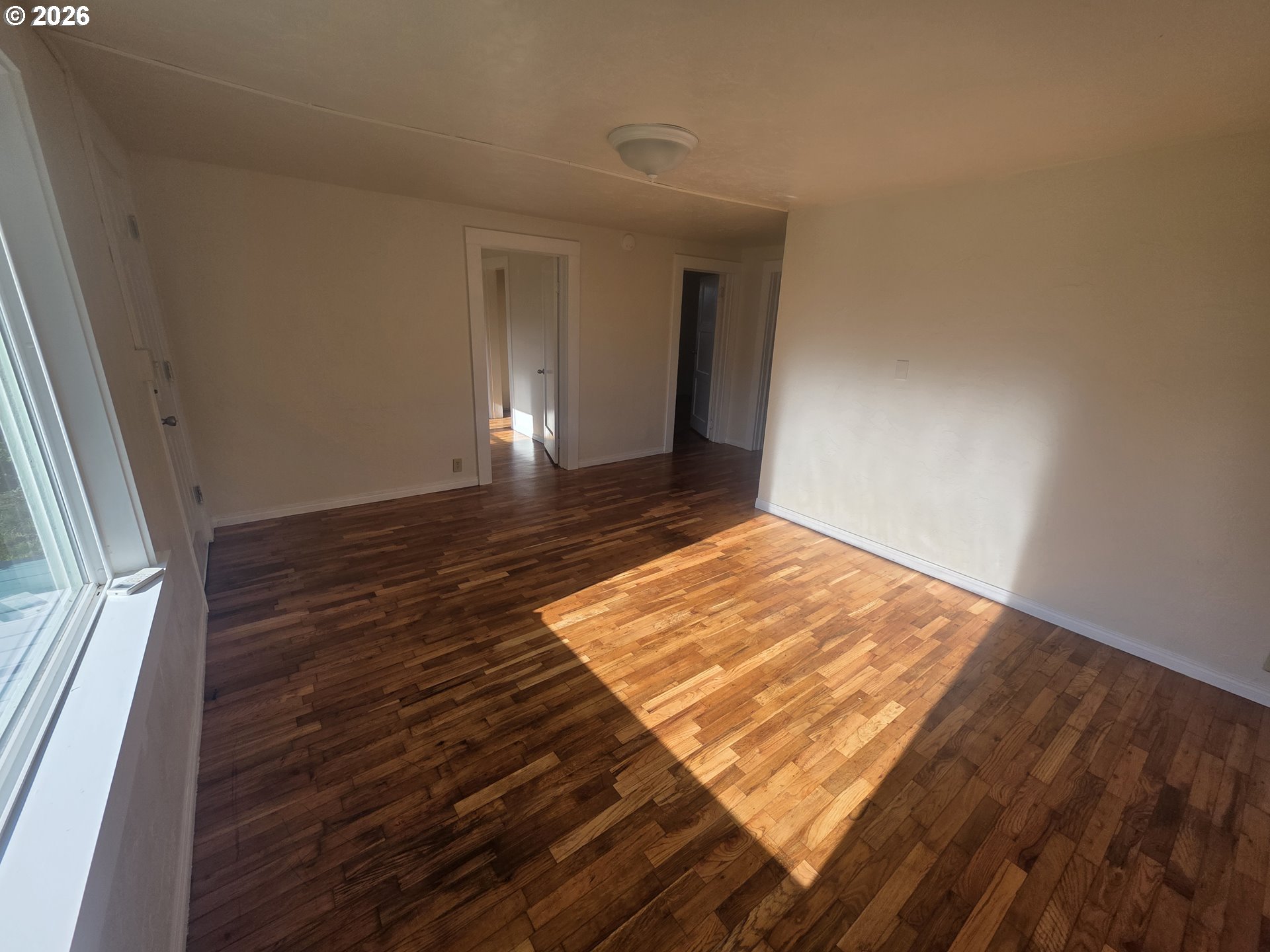 770 Elm Street Junction City, OR 97448 - Photo 11 of 30 a view of an empty room and wooden floor