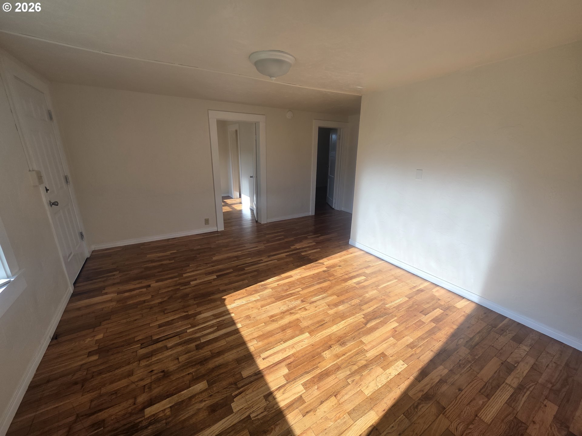 770 Elm Street Junction City, OR 97448 - Photo 12 of 30 a view of an empty room and wooden floor