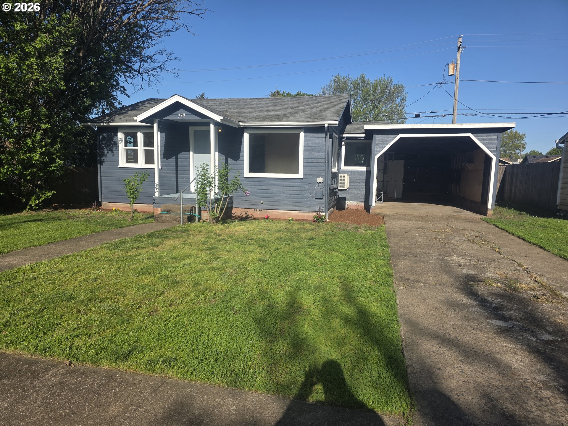 770 Elm Street Junction City, OR 97448 - Photo 3 of 30 a front view of a house with a yard and garage