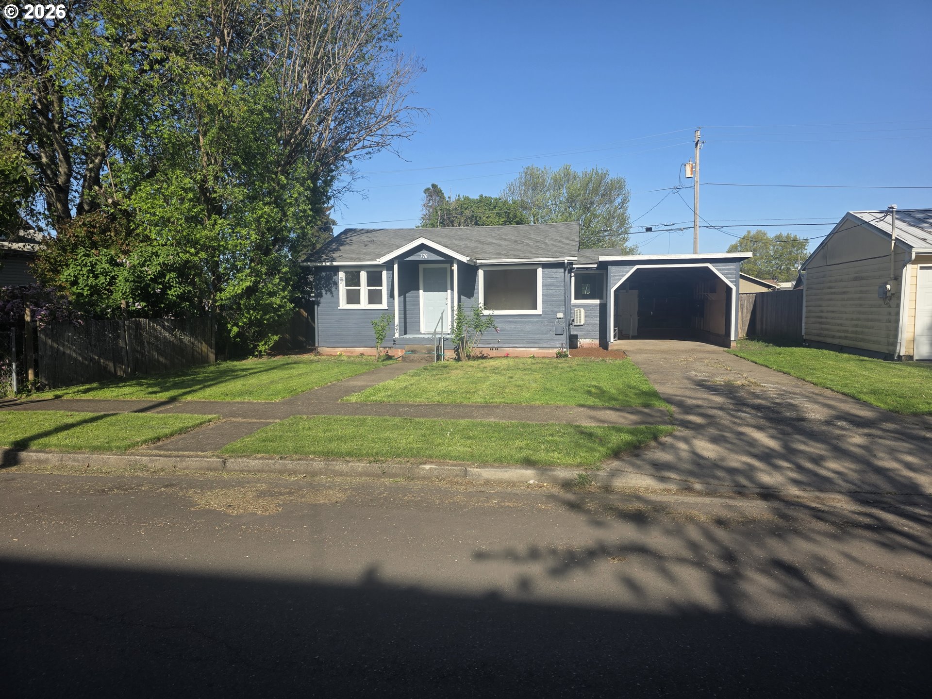 770 Elm Street Junction City, OR 97448 - Photo 4 of 30 a front view of a house with a yard