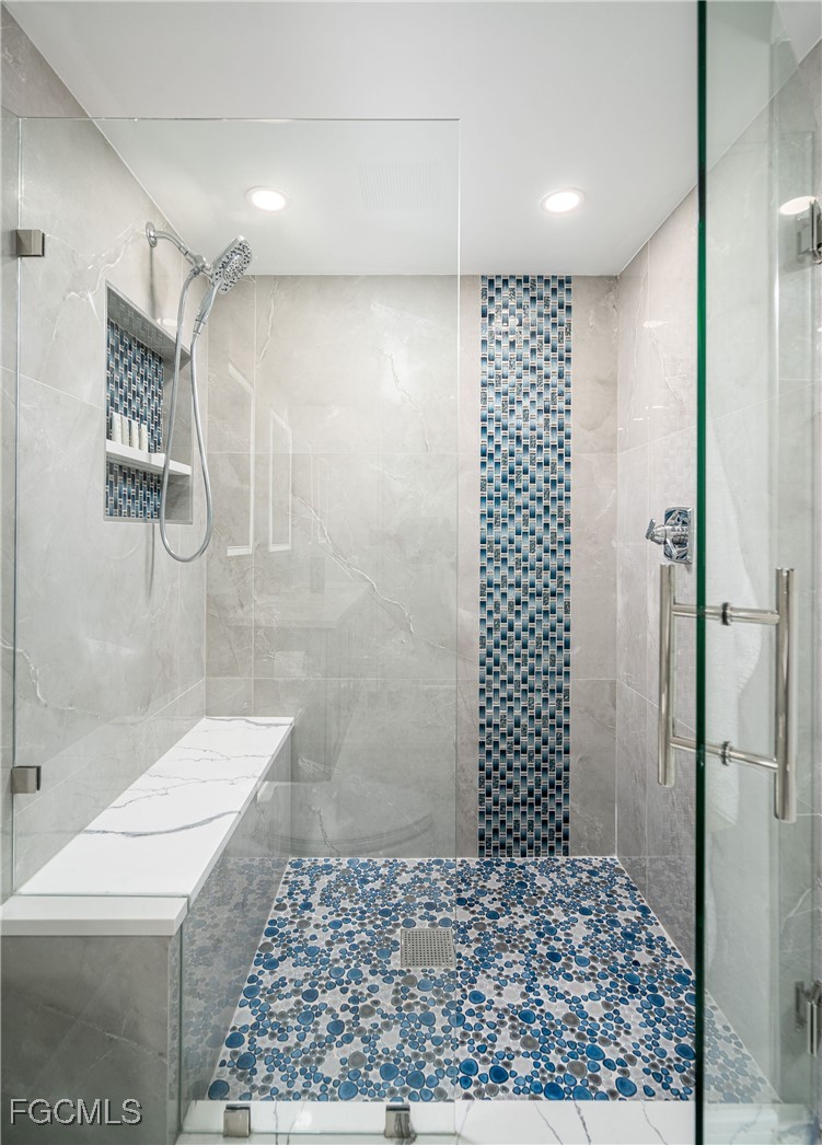17 Bluebill Avenue, Unit 903 Naples, FL 34108 - Photo 14 of 33 a bathroom with a shower