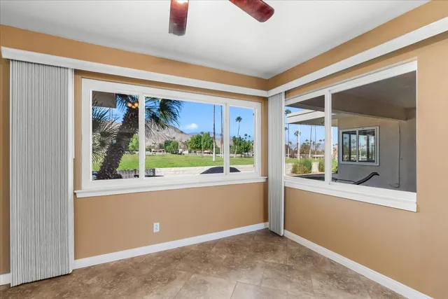 a kitchen with a sink and large cabinets
