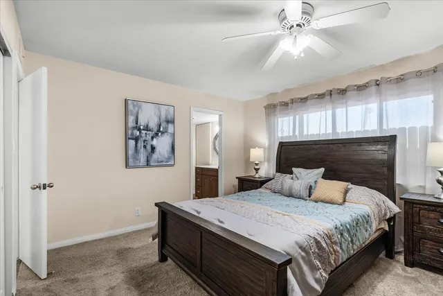 a view of a swimming pool with a patio and a yard