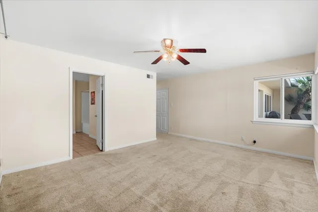 a view of a house with a yard and table