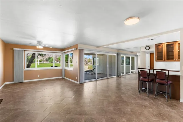 a view of livingroom with hardwood floor and a ceiling fan