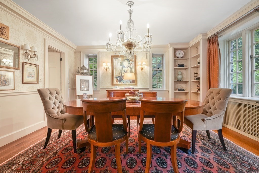 110 Hundreds Road Wellesley, MA 02481 - Photo 15 of 42 a view of a dining room with furniture wooden floor and chandelier