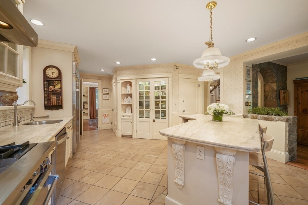 110 Hundreds Road Wellesley, MA 02481 - Photo 18 of 42 a large kitchen with kitchen island a sink stainless steel appliances and cabinets