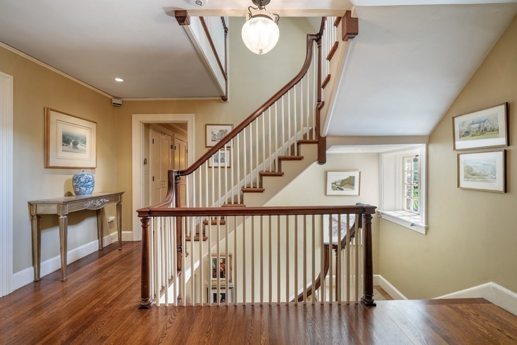 110 Hundreds Road Wellesley, MA 02481 - Photo 23 of 42 a view of entryway with wooden floor and stairs
