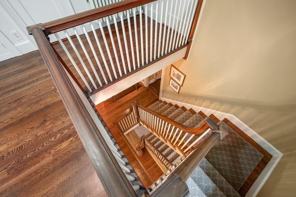 110 Hundreds Road Wellesley, MA 02481 - Photo 25 of 42 a view of staircase going to roof with wooden floor